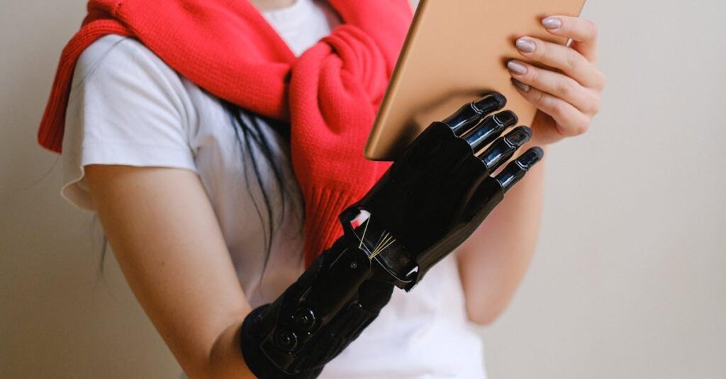 A person with a bionic hand holding a tablet, showcasing advanced prosthetic technology.